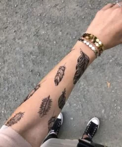 Feather sleeve tattoo